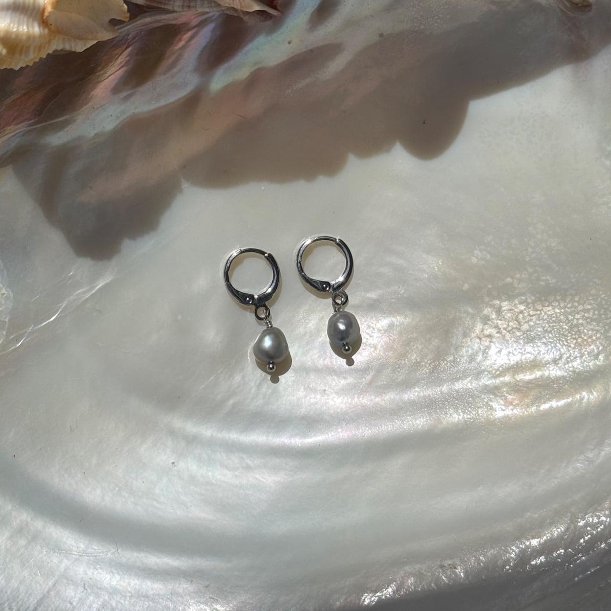 Gray freshwater pearl huggie earrings in stainless steel silver