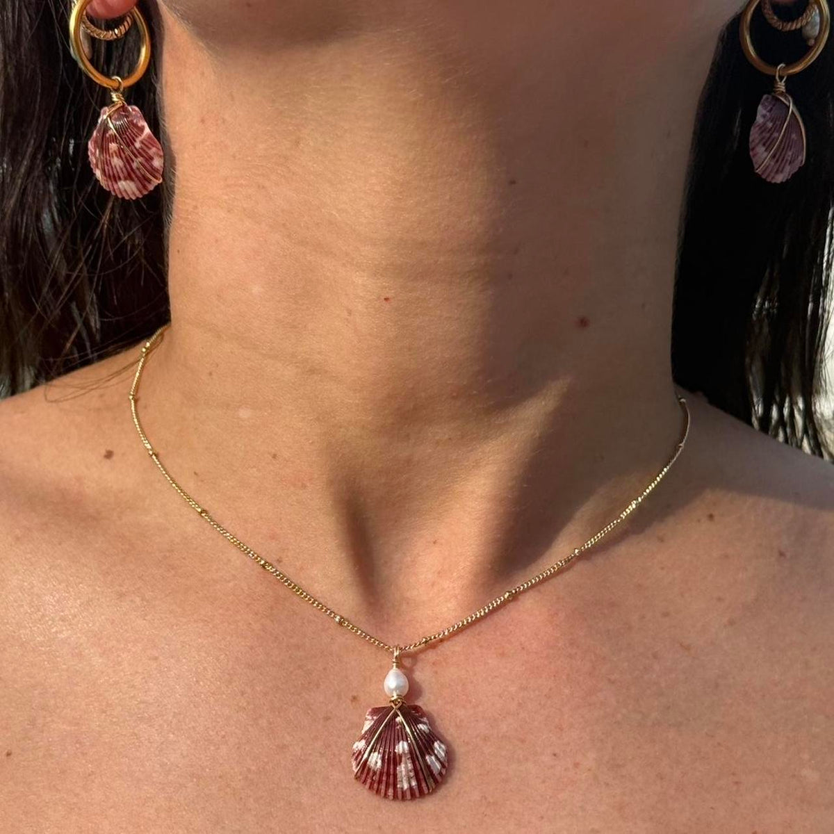 Burgundy Bay Set necklace and matching shell earrings worn together