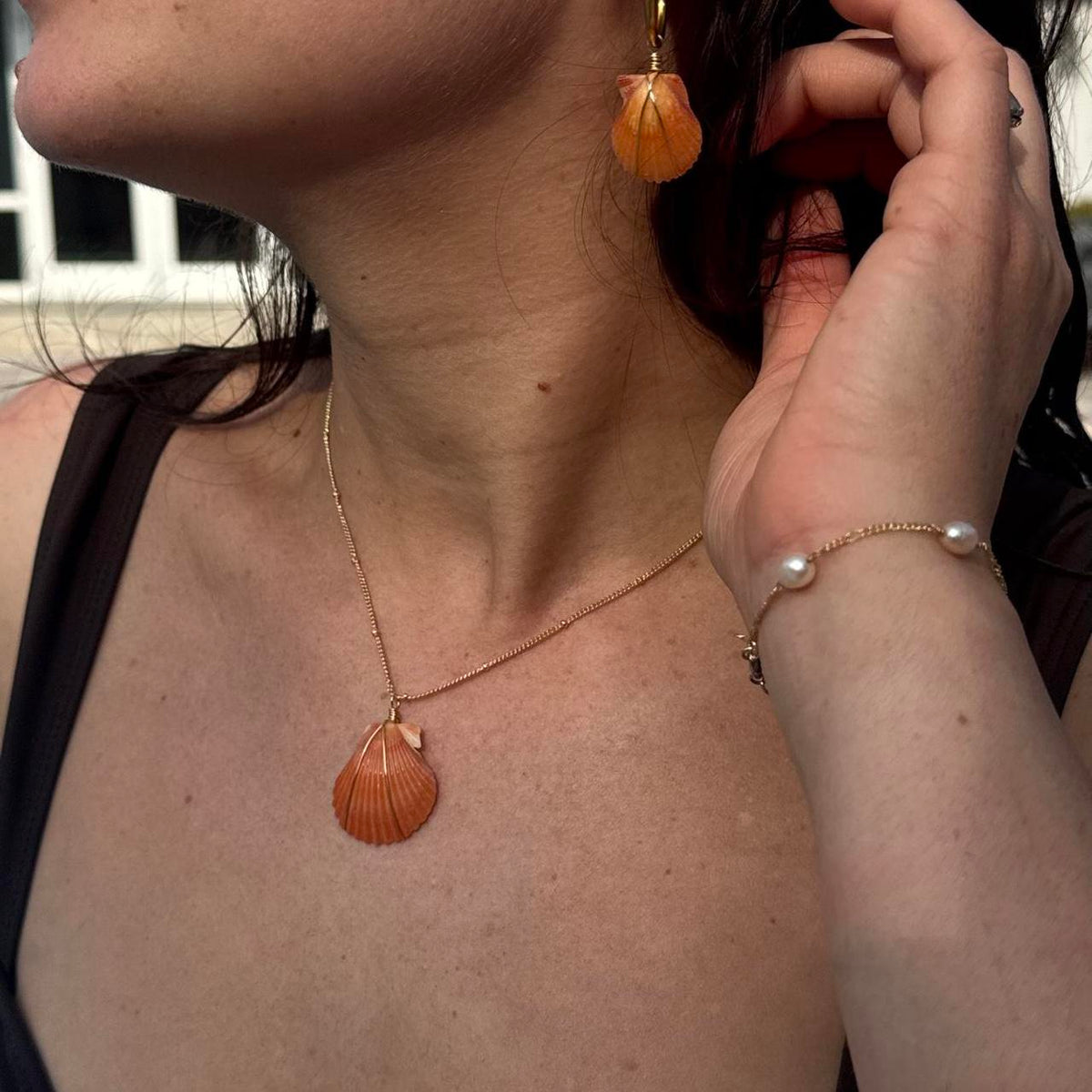 Coastal Ember shell necklace and earring styled together