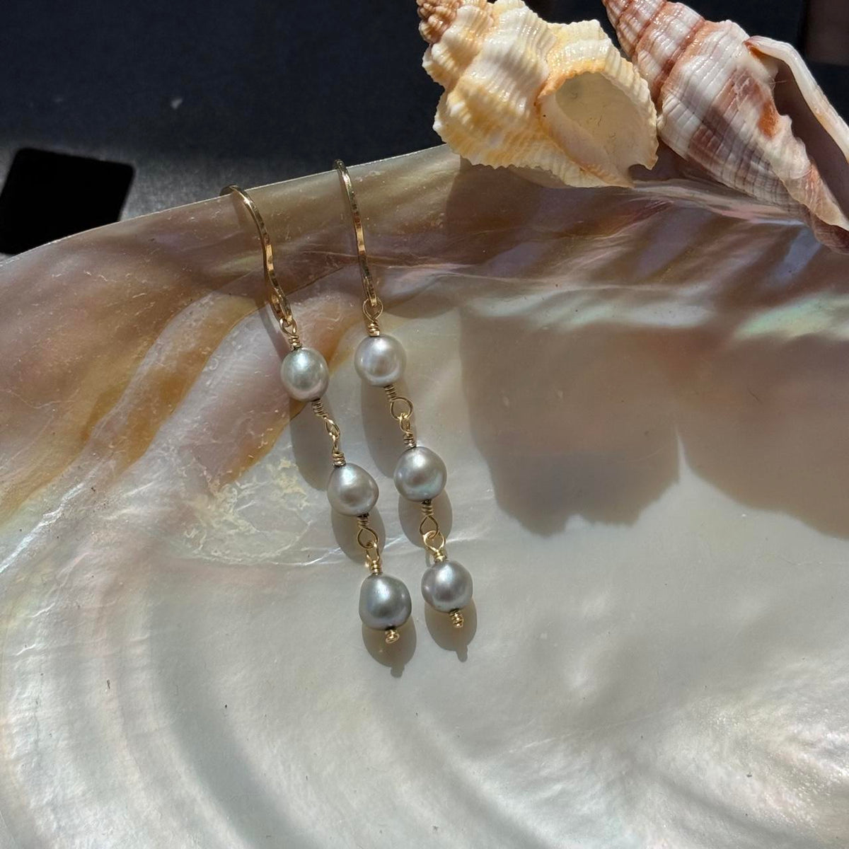 Gray pearl drop earrings in gold