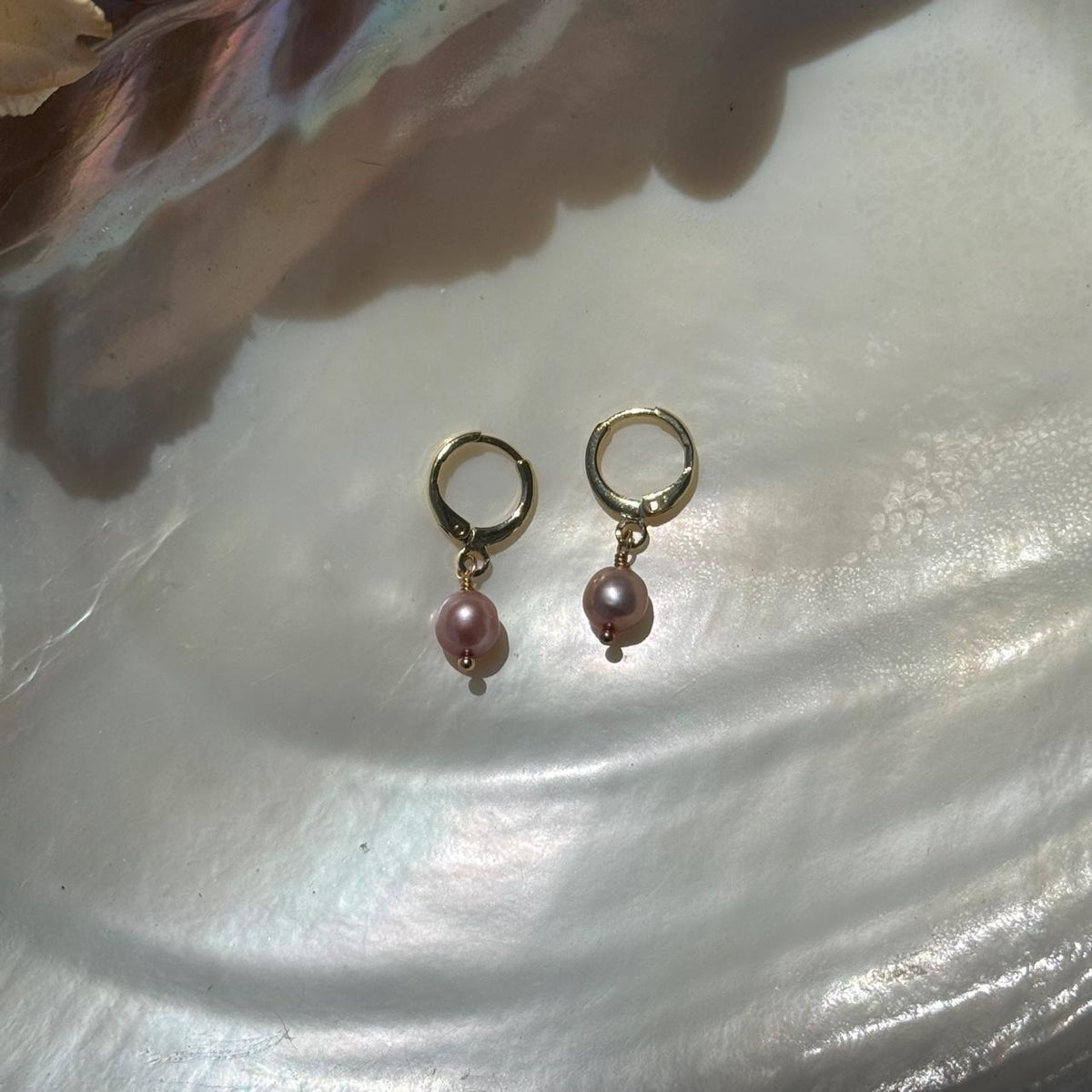 Pink freshwater pearl huggie earrings in gold
