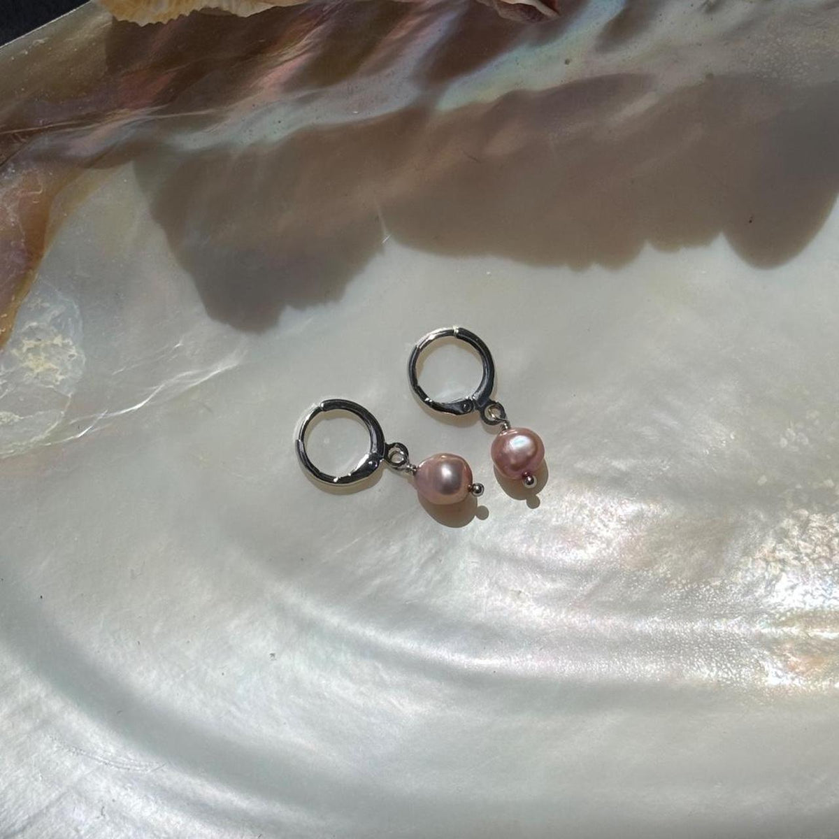 Pink freshwater pearl huggie earrings in silver