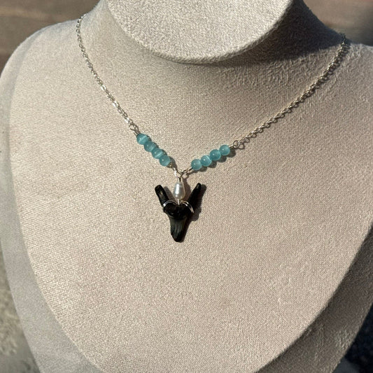 Tidepool Shark Tooth Necklace displayed on a jewelry bust