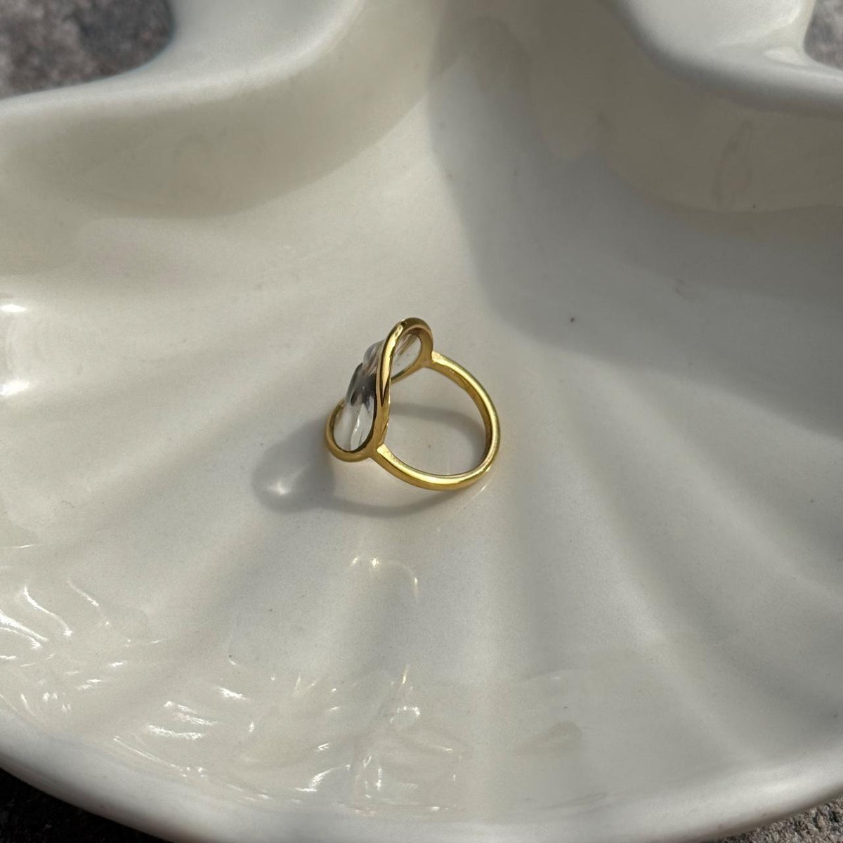 Side view of 18K gold-plated stainless steel shark tooth ring