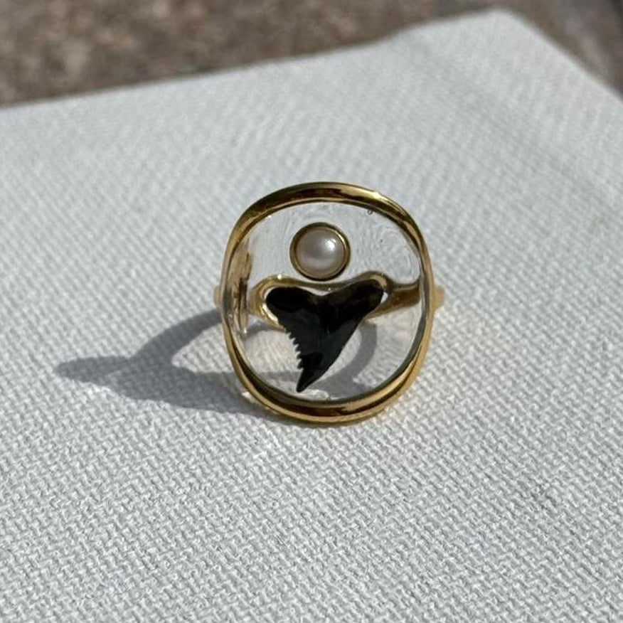Genuine shark tooth and pearl accent suspended in clear resin ring