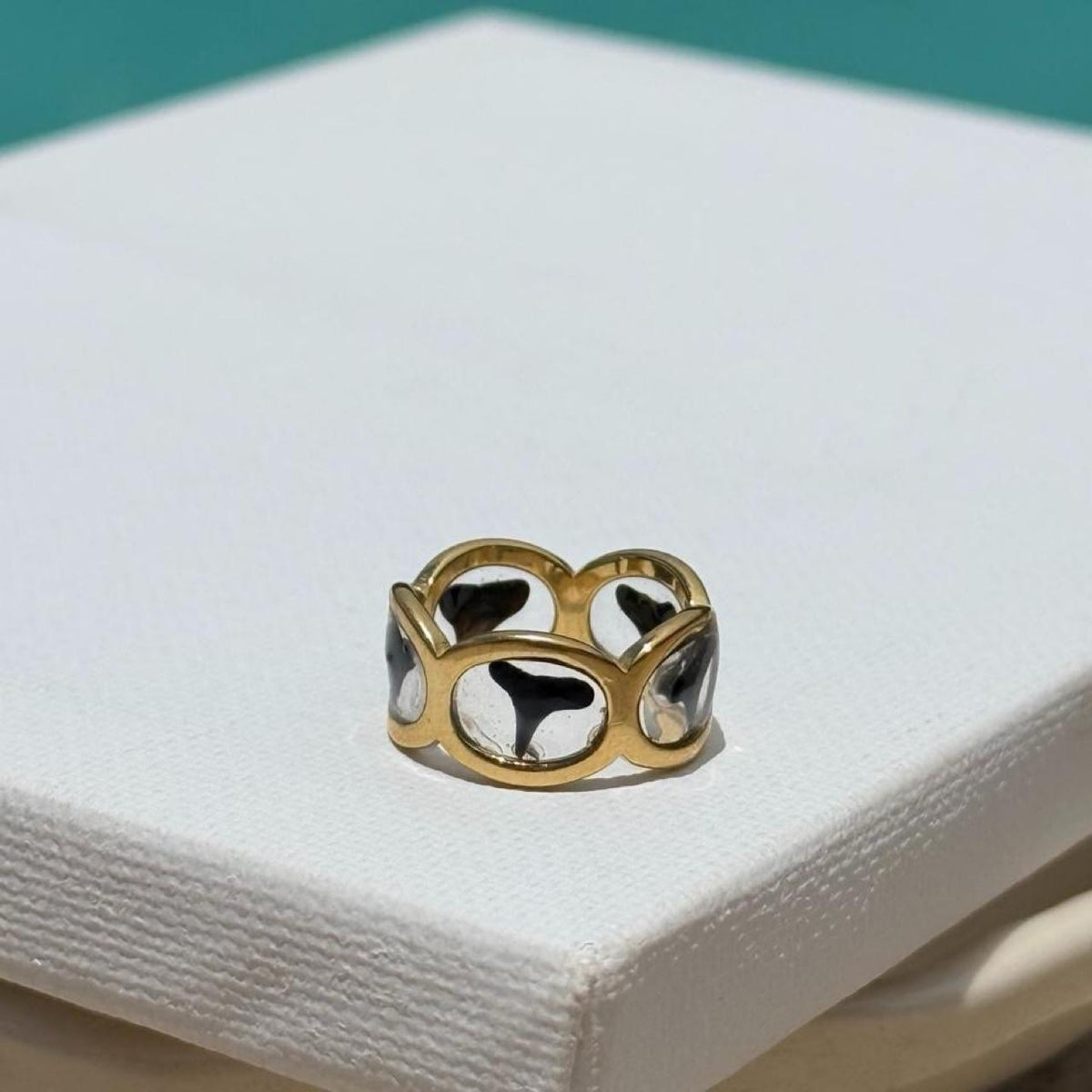 Shark tooth resin band ring displayed in sunlight