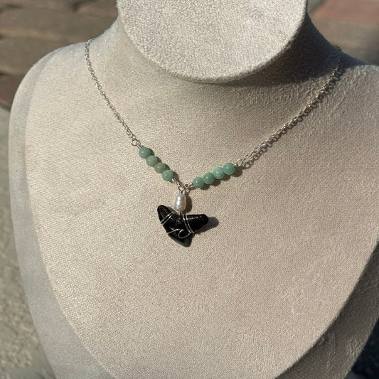 Lagoon Shark Tooth Necklace displayed on a jewelry bust