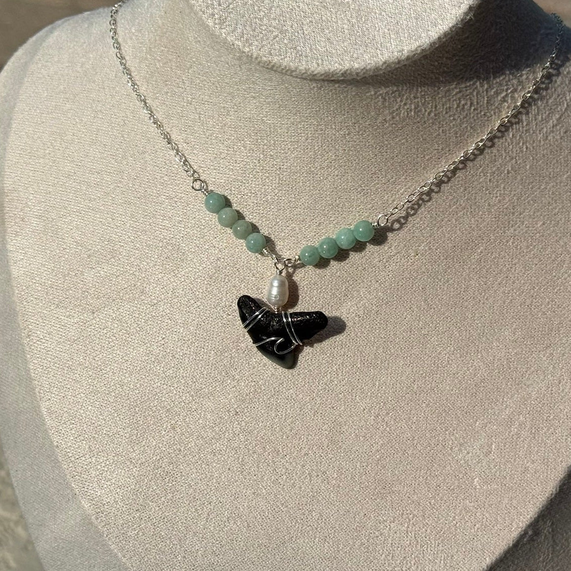 Close view of handmade shark tooth necklace