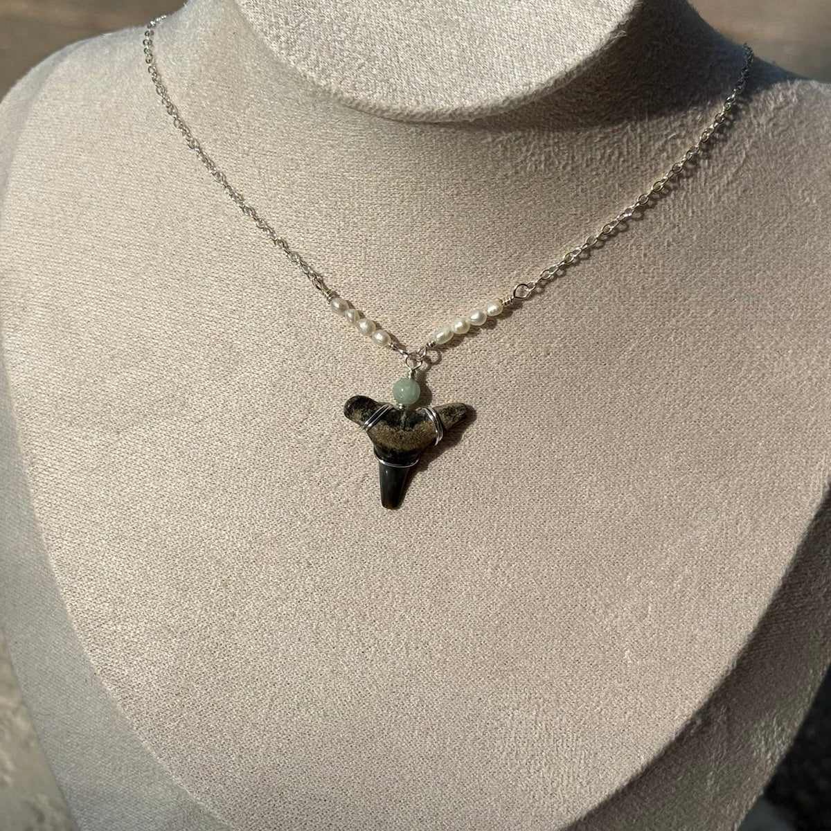 Pearl Cove Shark Tooth Necklace displayed on a jewelry bust