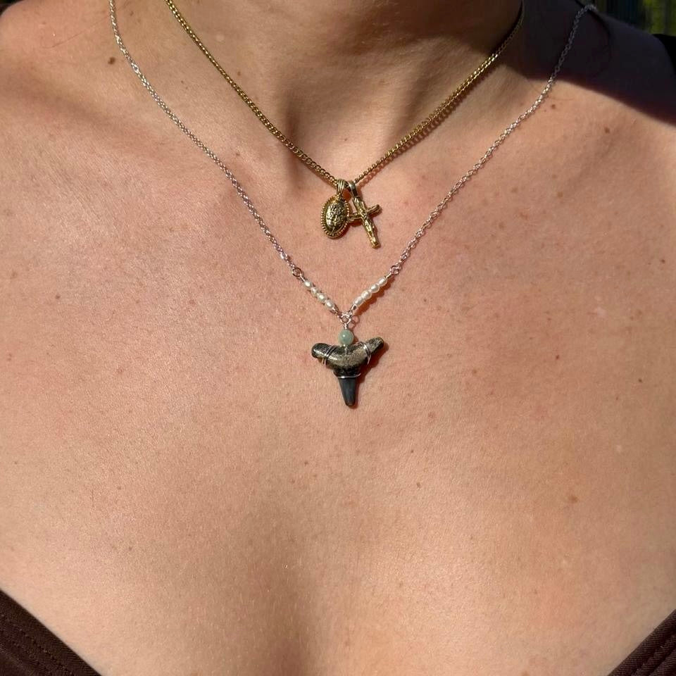 Pearl and shark tooth necklace shown worn