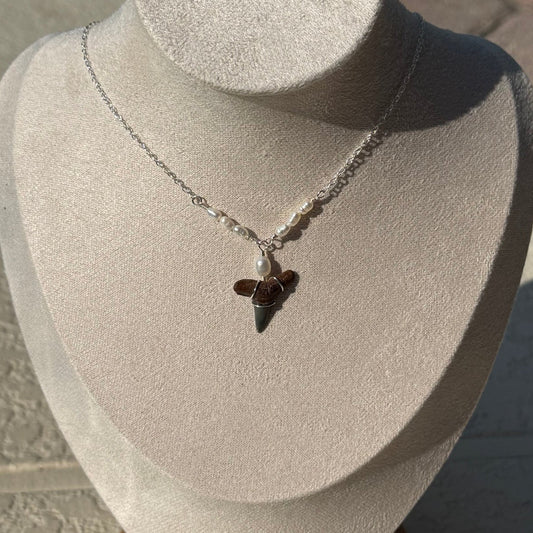 Driftwood Pearl Shark Tooth Necklace displayed on a jewelry bust