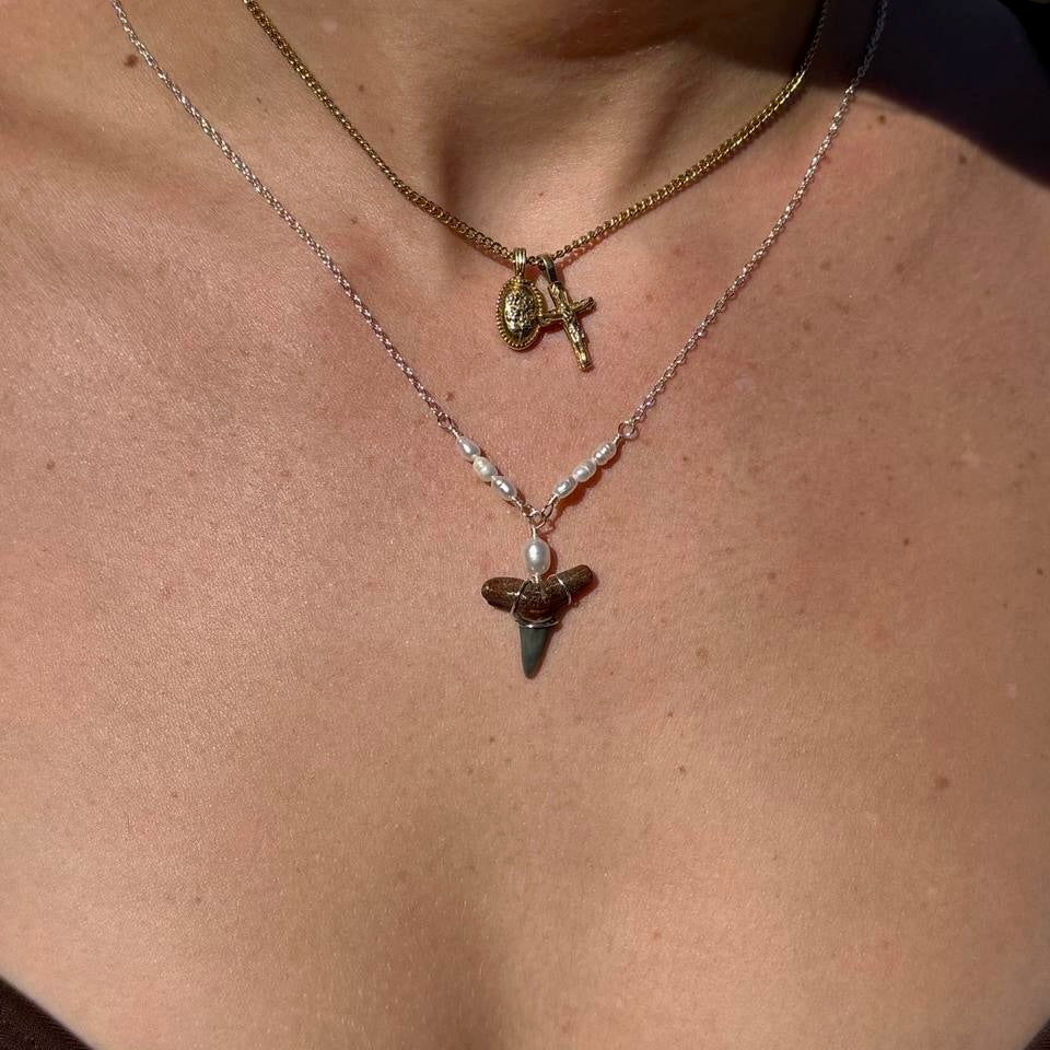Close-up worn view of Driftwood Pearl Shark Tooth Necklace