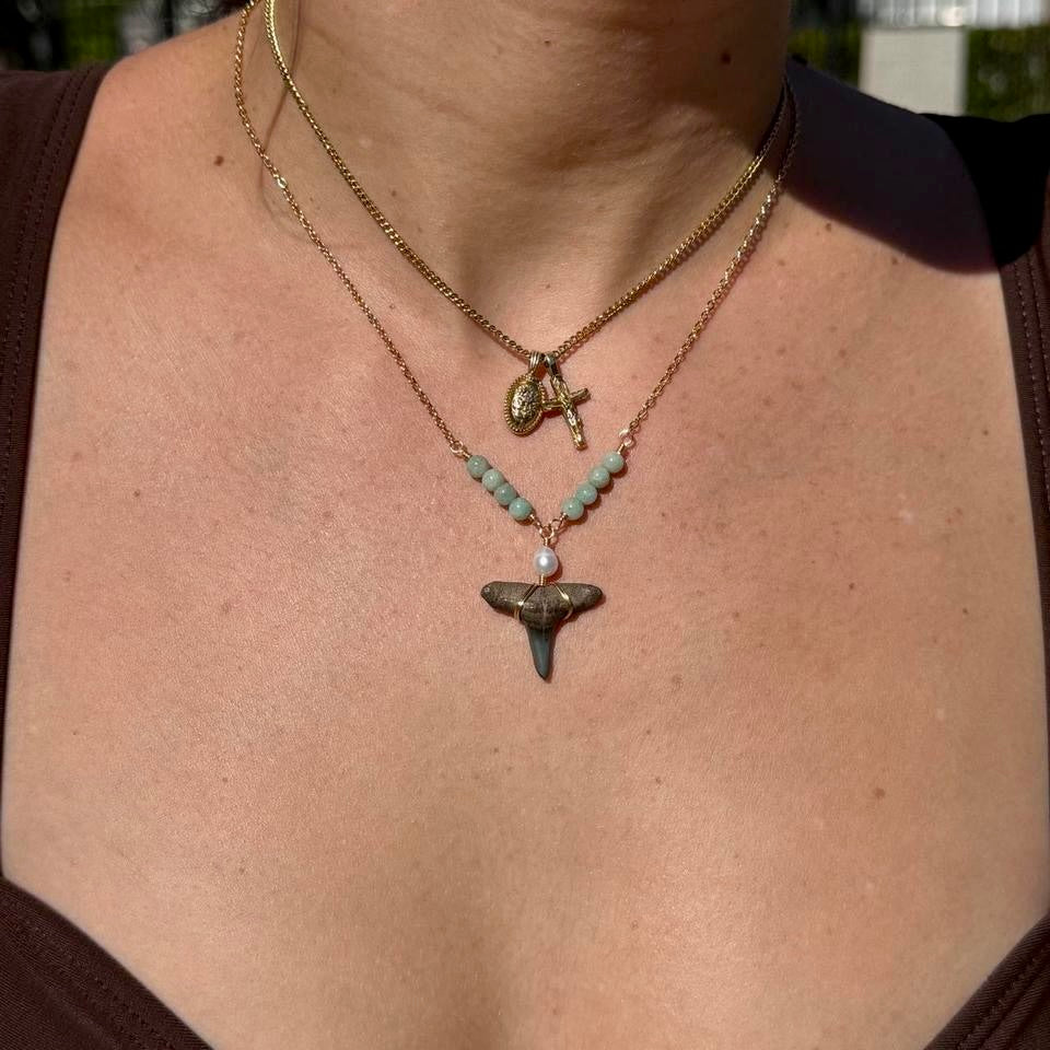 Handmade gold-tone coastal shark tooth necklace styled on model