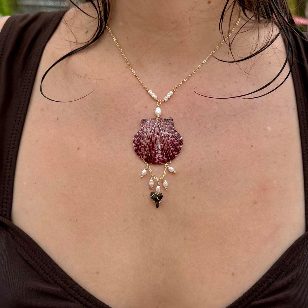 Coastal statement scallop shell necklace worn outdoors